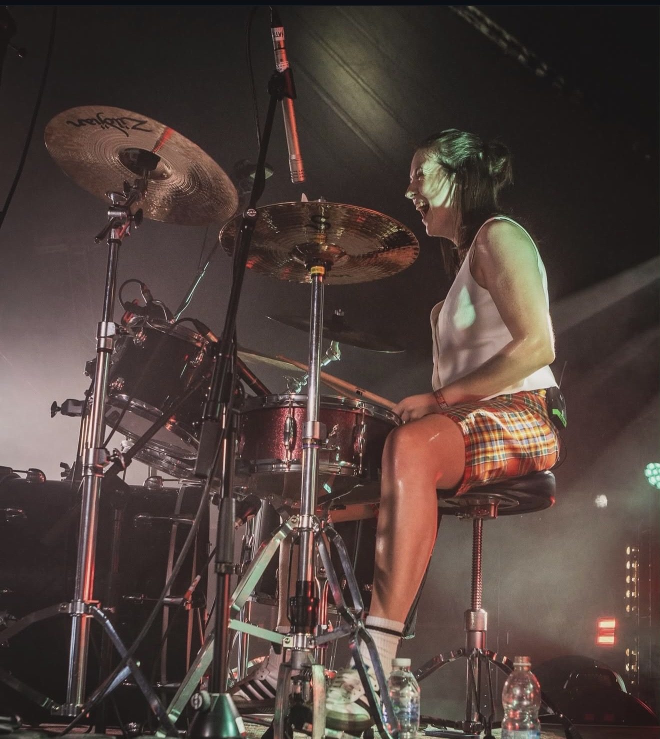 ACB laughing behind the kit at a festival